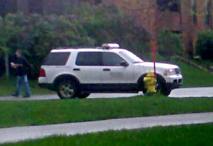 Security vehicle next to fire hydrant